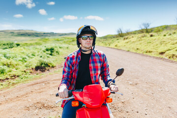 young hipster rider in helmet enjoying the trip. Adventure and vacations concept