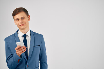 business man in a suit with a phone in his hands internet communication technology