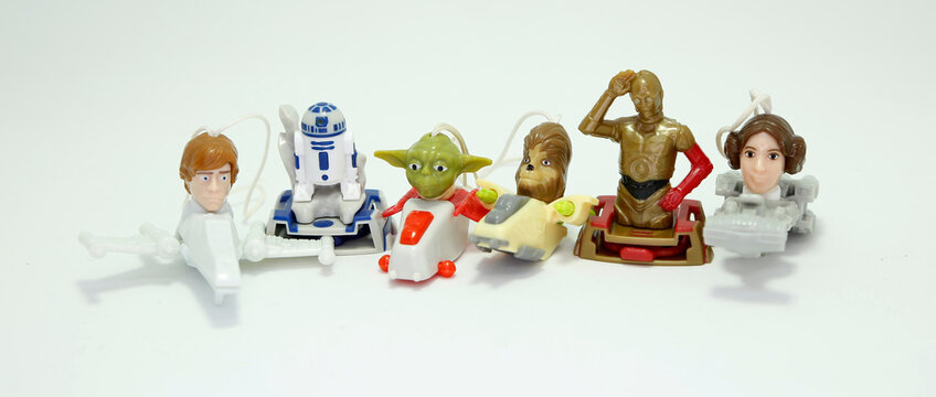 Star Wars. Movie's characters. Toys. Yoda, R2 d2, Luke Skywalker, princess Leia, Chewbacca, C 3PO. Small collectible toys. Saga. Isolated white. Kinder surprise. Good guys.