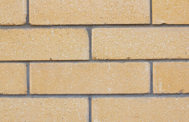 Brick wall with yellow brick, brick background.