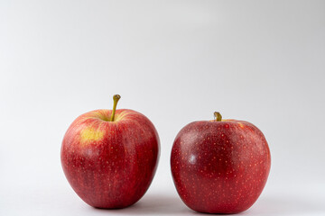 Two red apples against a white background. Royal gala apples. Food product photography