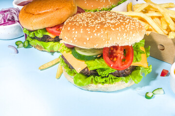 Various burgers set on blue background