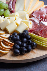 Charcuterie board with selection of meat and cheese close up