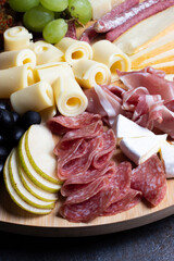 Charcuterie board with selection of meat and cheese close up