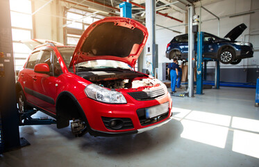 Modern car repair station with a large number of lifts and specialized equipment for diagnostics...