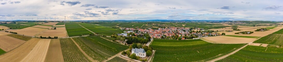 Fototapeta na wymiar Panorama from a bird's eye view of the vineyards near Udenheim / Germany in Rheinhessen with the mountain church 