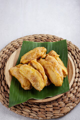 Pisang goreng or banana fritters is popular street food in South East Asia, especially in Malaysia and Indonesia. Made from fried banana covered with sweet batter