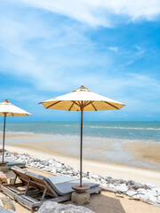 Seascape view and sunlight under cloudy blue sky with umbrella