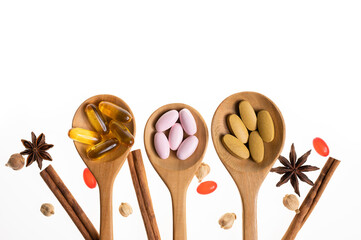 Herbal capsule from herbs nature for good health, vitamin, mineral supplement pills for medication disease on wooden medical background with copy space, medicine and drug concept