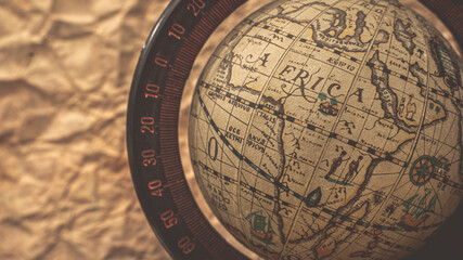 Fototapeta na wymiar Globe Model On Old Map