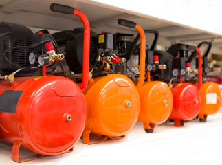 Fototapeta premium Many Air compressors pressure pumps closeup photo. Air compressor pressure pumps.
