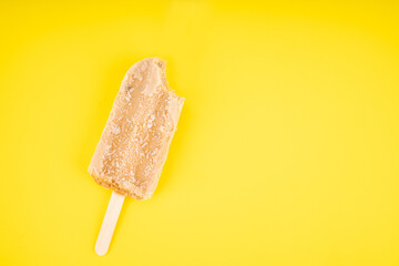 Tea flavored ice cream sticks on yellow background. Copy space for your text