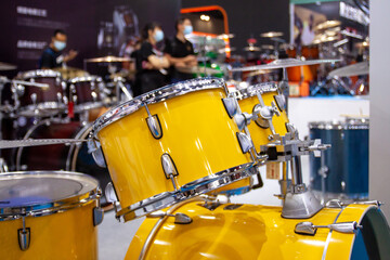 Set of new modern yellow drums in the studio, professional drums 
