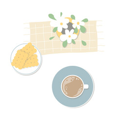 A cup of coffee with a cookies and flowers. Top view on the table. Cozy breakfast.