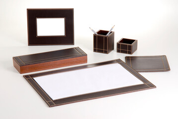 Office leathery kit with pencil and paper holder and portrait frame, isolated