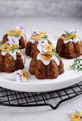 Cake pisang. Mini banana bundt cake topping with edible flower.