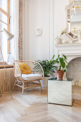 bright workshop room for the creation and work of an architect and artist in a loft style with brick walls and parquet. the walls are decorated with examples of stucco.