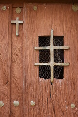 Old church door with a cross