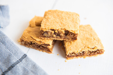 homemade walnut pie on wooden background close up