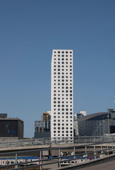 Fototapeta na wymiar Dotted shape windows on a tower building at arena in the district Solna in northern Stockholm