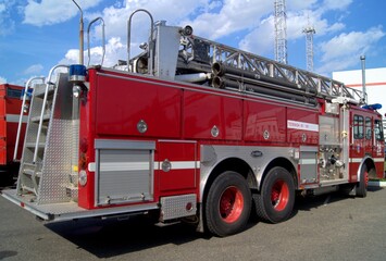 Fire truck with retractable ladder for extinguishing fires at height.  A fire truck for delivering firefighters to the fire site and supplying fire extinguishing agents to the combustion center.
