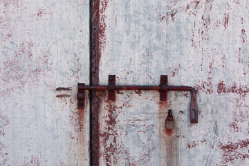 Old door with rusty lock, grunge background