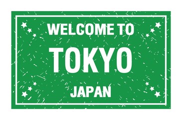 WELCOME TO TOKYO - JAPAN, words written on green rectangle stamp