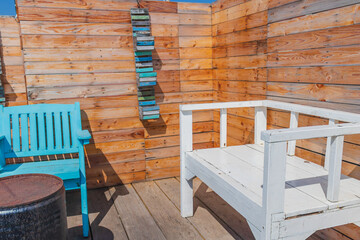 Fototapeta na wymiar outdoor seating on a wooden floor