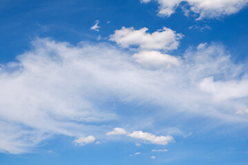 fluffy white clouds on a deep blue sky in summer