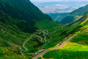 Fototapeta na wymiar Panoramic view over the Transfagarasan road located in Romania, Sibiu county. Birds eye view over a road in the mountains