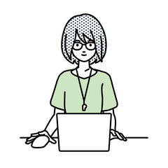 デスクで座ってPCを使っている教師の女性