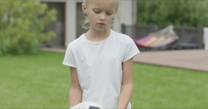 girl holding a soccer ball