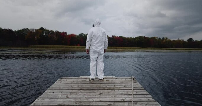 Fourth Wave Delta Variant: lockdown hazardous material suit during the fall season as virus rages causing fear and anxiety