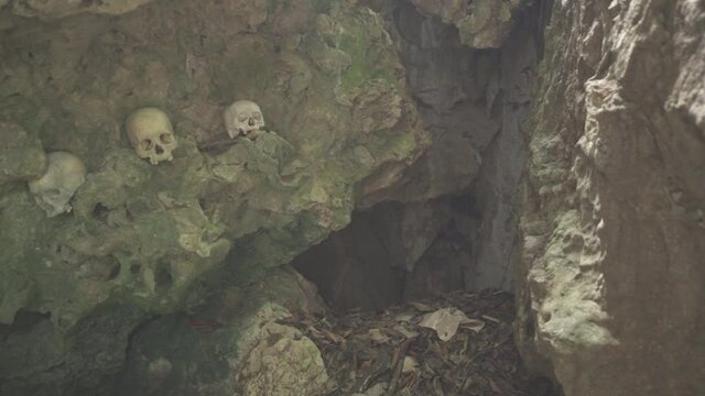 Tampang Allo, Tana Toraja, Indonesia - Tau Tau Human Skulls Piles of Bones Burial Graves Cave