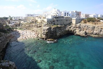 Fototapeta na wymiar View of the beach and town Polignano a mare in South Italy, tourist destination