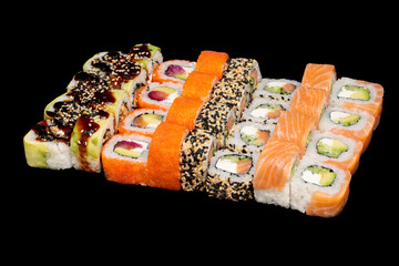 Traditional japanese nigiri sushi, separated on black stone background