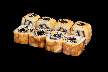 Japanese food: maki and nigiri sushi set on black background. side view composition.