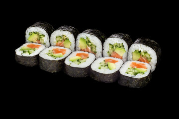 Japanese food: maki and nigiri sushi set on black background. side view composition.