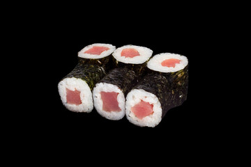 Japanese food: maki and nigiri sushi set on black background. side view composition.