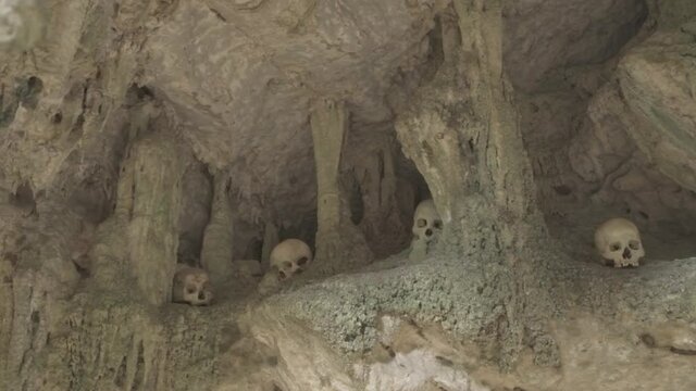 Tampang Allo, Tana Toraja, Indonesia - Tau Tau Human Skulls Piles of Bones Burial Graves Cave