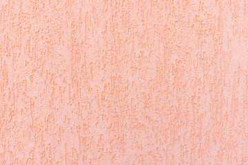 Decorative plaster and pink paint on the walls.Rough, uneven surface. Vintage background and texture.