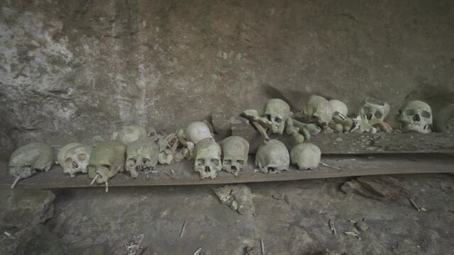 Tampang Allo, Tana Toraja, Indonesia - Tau Tau Human Skulls Piles of Bones Burial Graves Cave