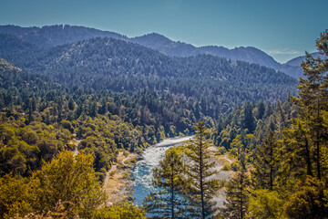 Trinity River in Northern California before the 2021 wildfires with rapids and tree covered hills...