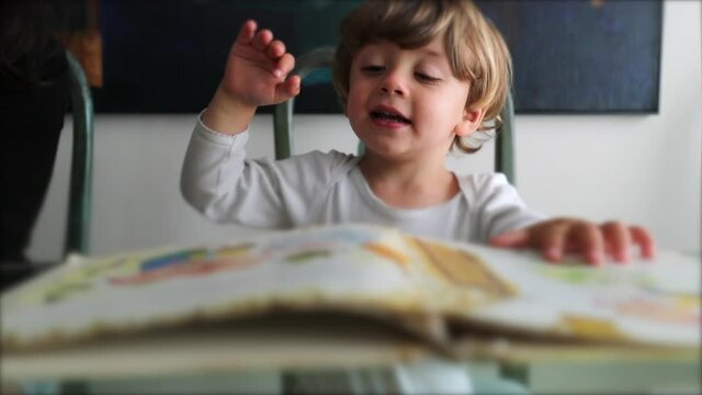 Child learning to read kid book