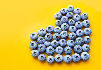 Heart symbol made of blueberries