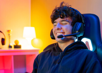 Cheerful gamer using headset with mic
