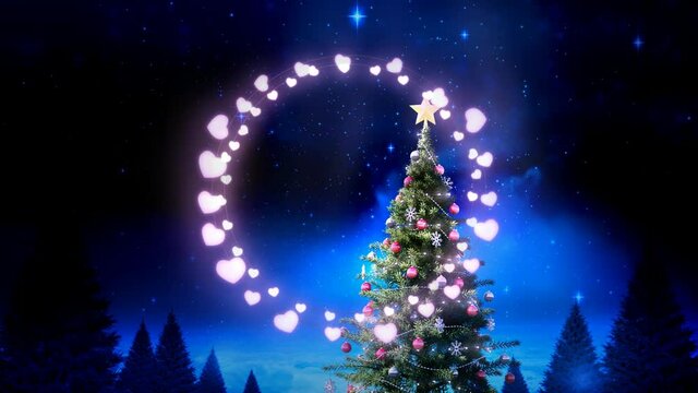 Pink heart shaped fairy lights against christmas tree and shining stars at night sky