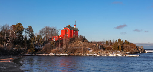 Panoramic view of Marquette harbor light house at lake Superior shoreline