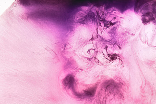 Abstract pink purple cloud of smoke, paint in water background. Fluid art wallpaper, liquid vibrant bright colors. Concept aphrodisiac perfume