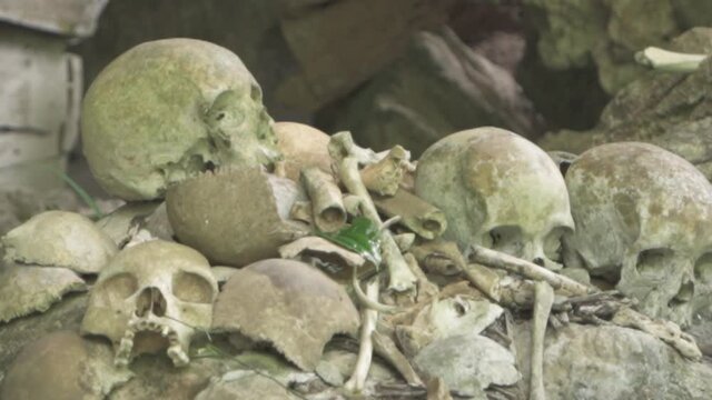 Tampang Allo, Tana Toraja, Indonesia - Tau Tau Human Skulls Piles of Bones Burial Graves Cave